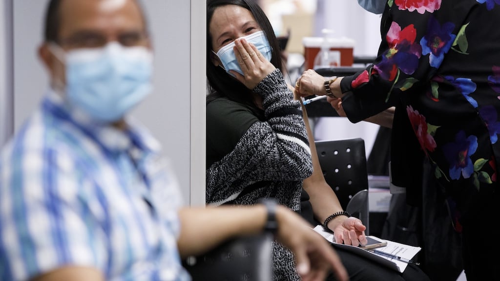 A healthcare worker administers a Moderna Inc Covid-19 vaccine from Humber River Hospital’s mobile vaccination clinic at the Apotex Inc. pharmaceutical facility in Toronto, Ontario, on Tuesday. Photograph: Bloomberg