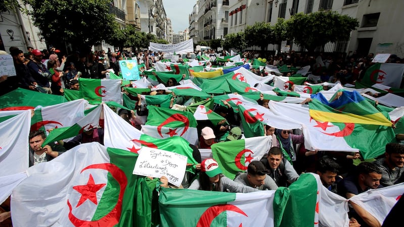 Anti-government protests in Algiers, Algeria, with a banner reading “Government go away – students take over”. Photograph: Ramzi Boudina