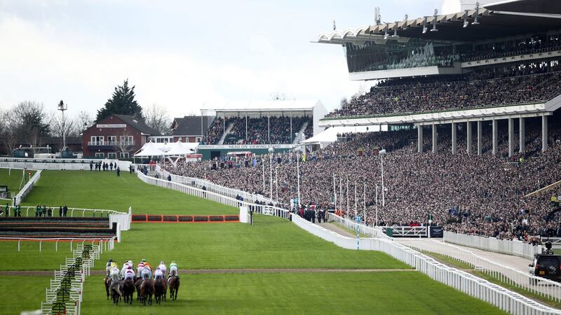 The runners and riders pass in front of the packed grandstand during the opening race of the 2020 Cheltenham festival. Photo: Tim Goode/PA Wire.