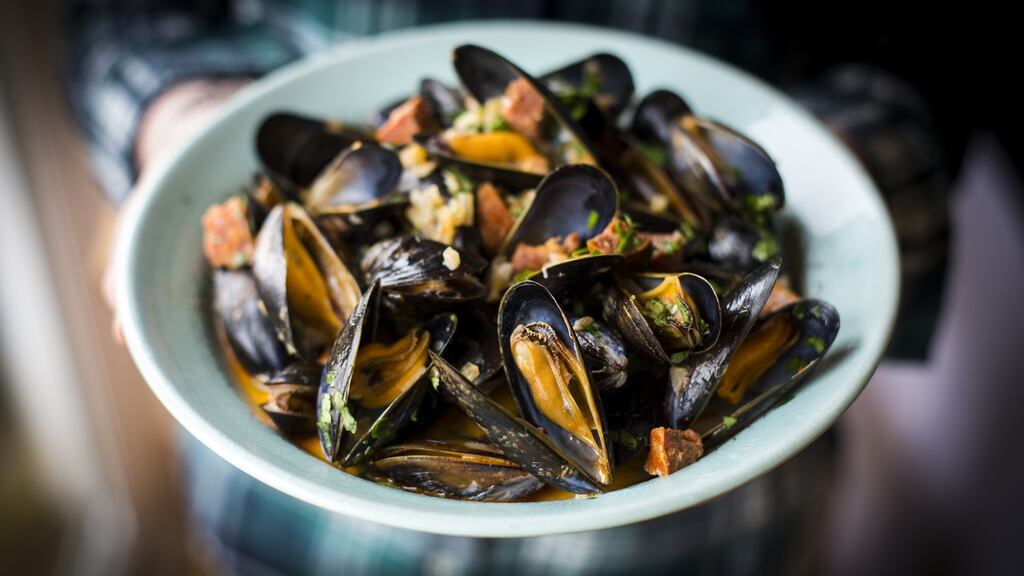 Clean the mussels and discard any that are open before cooking and any that stay closed after cooking.
