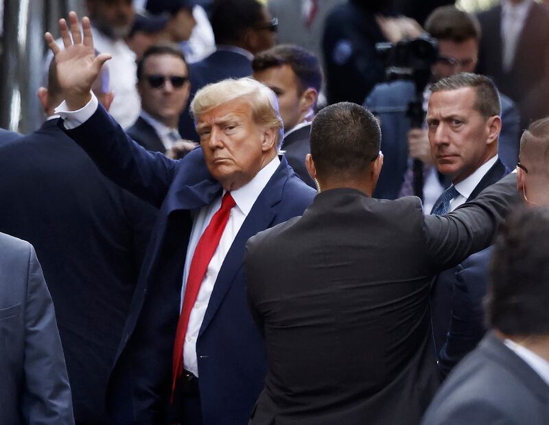 Donald Trump waves as he arrives at the Manhattan Criminal Court for his arraignment hearing in April, 2023. Photograph: Kena Betancur/Getty Images