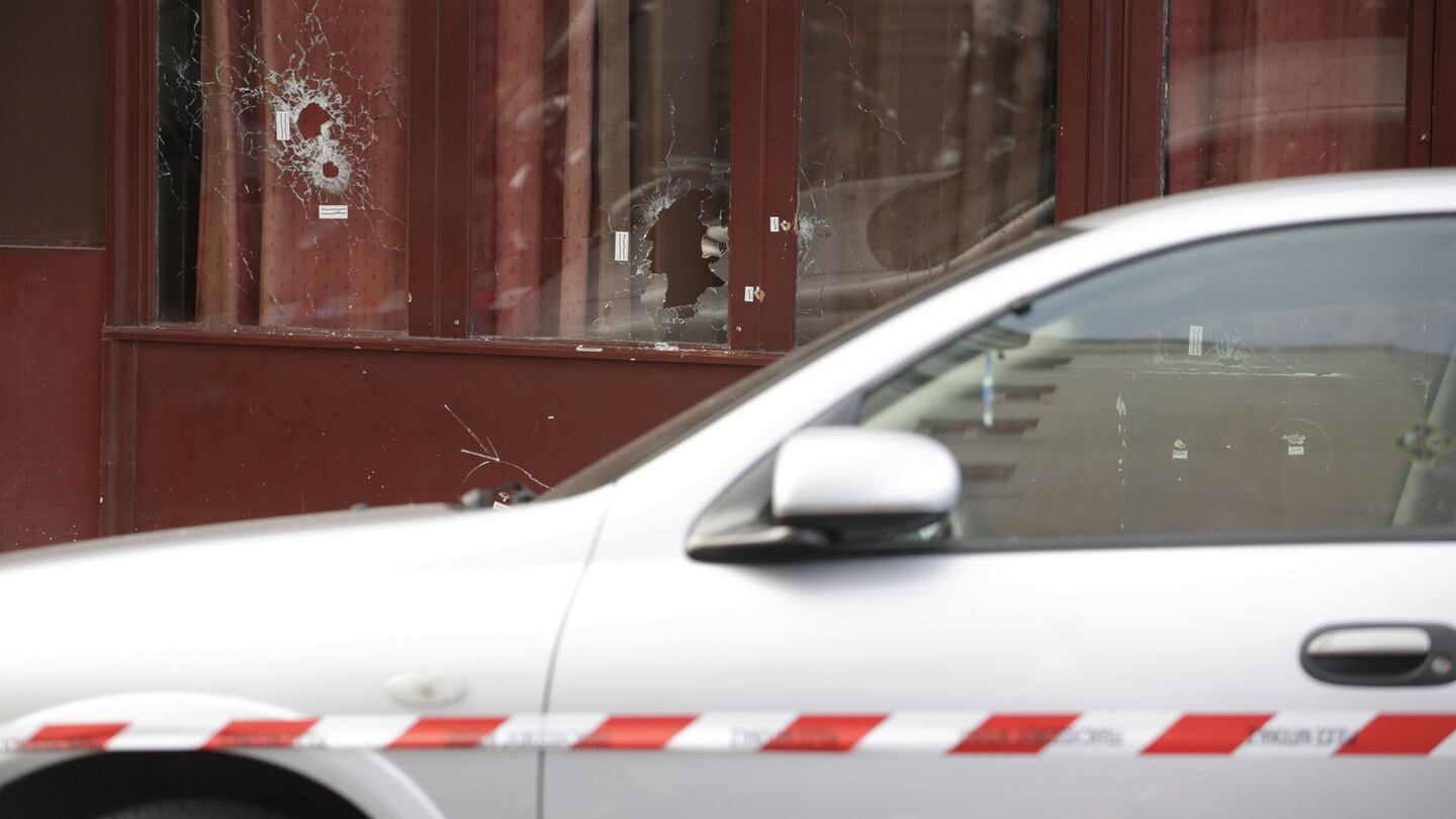 Bullet holes in windows of the Carillon bar, following the attacks in Paris. Photograph:  AFP