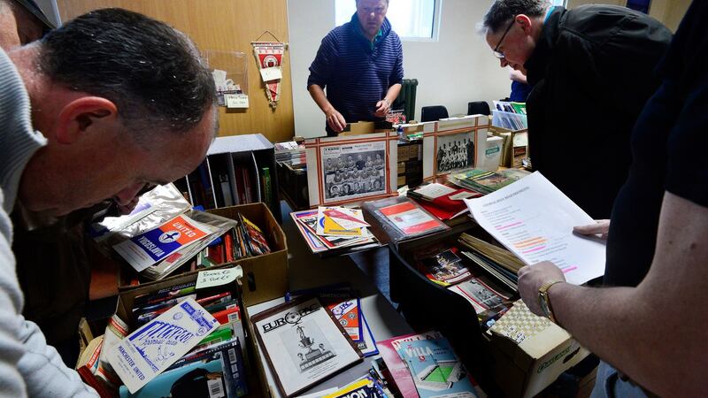 Programme collectors flick through some of the options on offer. Photograph: Cyril Byrne