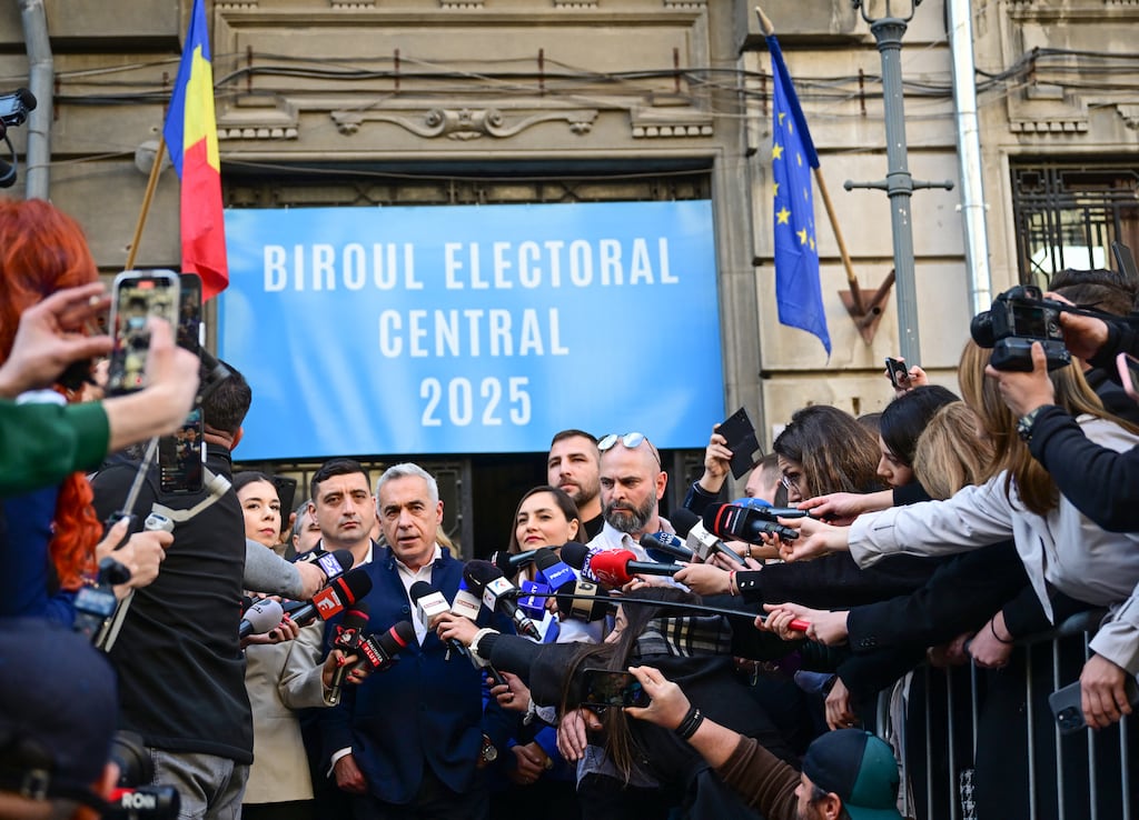 Far-right presidential candidate Calin Georgescu after officially filing his candidacy for the Romanian presidential election last Friday. He is appealing a subsequent ruling from electoral authorities that he cannot run to the courts.
 (Photo by Daniel Mihailescu / AFP)
