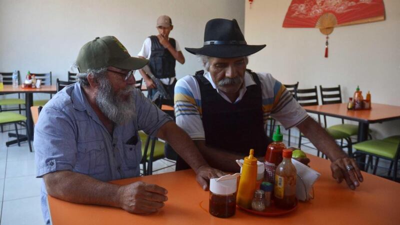 ‘El Doctor’ and autodefensas leader José Manuel Mireles (right), co-ordinator of the vigilante groups of the state of Michoacán, and spokesperson Estanislao Beltran, known as Papa Pitufo (Papa Smurf), in Arteaga. Photograph: Reuters/Alan Ortega