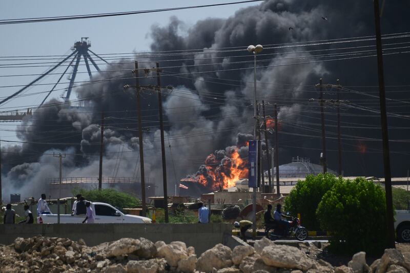 Smoke billows after drone strikes by the paramilitary Rapid Support Forces targeted the northern port in the Red Sea city of Port Sudan, Sudan. Photograph: AP
