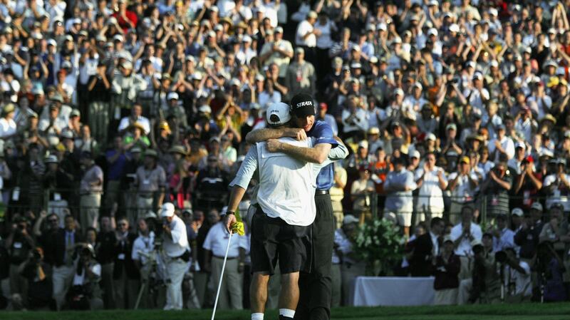 Jim Furyk hugs caddie Mike “Fluff” Cowen after winning the 2003 US Open on the North Course at the Olympia Fields Country Club in Illinois. Photograph: Jonathan Ferrey/Getty Images