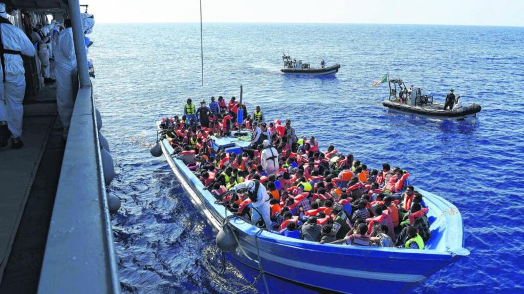 Naval Service rescue mission: LE Eithne crew prepare to bring migrants aboard in the Mediterranean in 2015. Photograph: David Jones/Defence Forces/PA