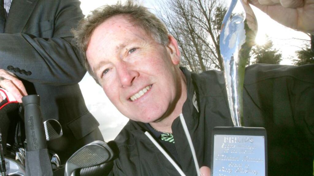 Golf coach Michael Bannon with his award
