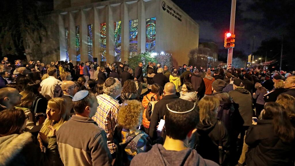 Rabbi Jeffrey Myers leads a gathering in Hanukkah songs outside the Tree of Life synagogue on the first night of Hanukkah, on Sunday, December 2nd, 2018. Photograph: Gene J Puskar