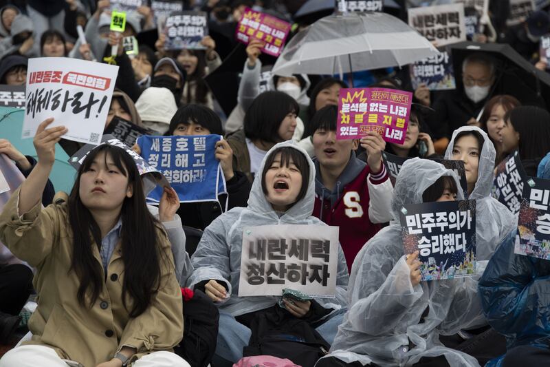 People gather in Seoul to celebrate president Yoon Suk Yeol's impeachment and removal from office. Photograph: EPA