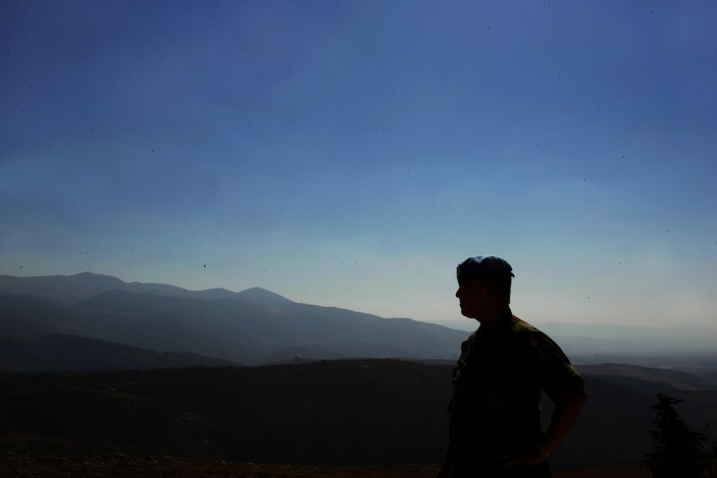 An Irish soldier with the Irish Defence Forces in Southern Lebanon looks out over the Jordan Valley. Photograph: Kate Geraghty