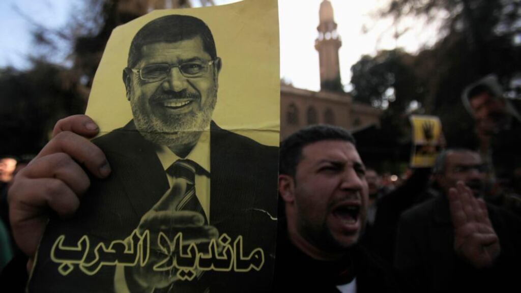 A member of the Muslim Brotherhood and supporter of ousted Egyptian president Mohamed Mursi shouts slogans against the military and interior ministry in front of Al Rayyan mosque after Friday prayers. Photograph: Amr Abdallah/Reuters