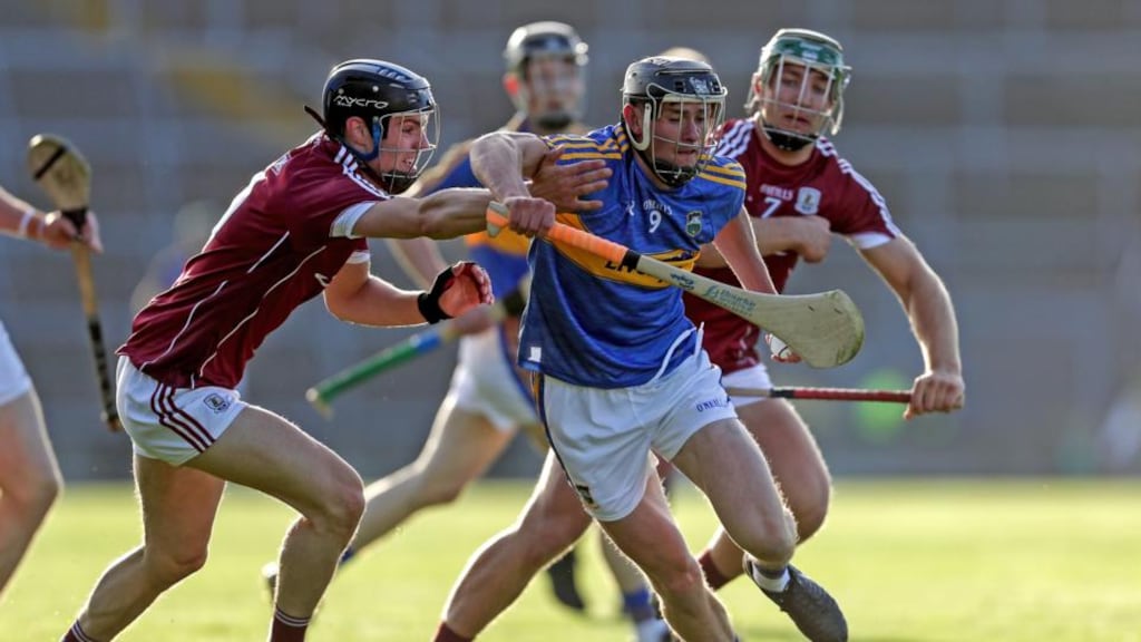 Tipperary’s Colin English gets past Sean Loftus of Galway during their under-21 All-Ireland semi-final encounter. Photo: Laszlo Geczo/Inpho