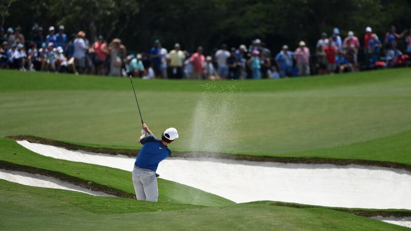 Jamie Lovemark of the United States plays his second shot from a bunker on the fifth hole. Photo: Ross Kinnaird/Getty Images
