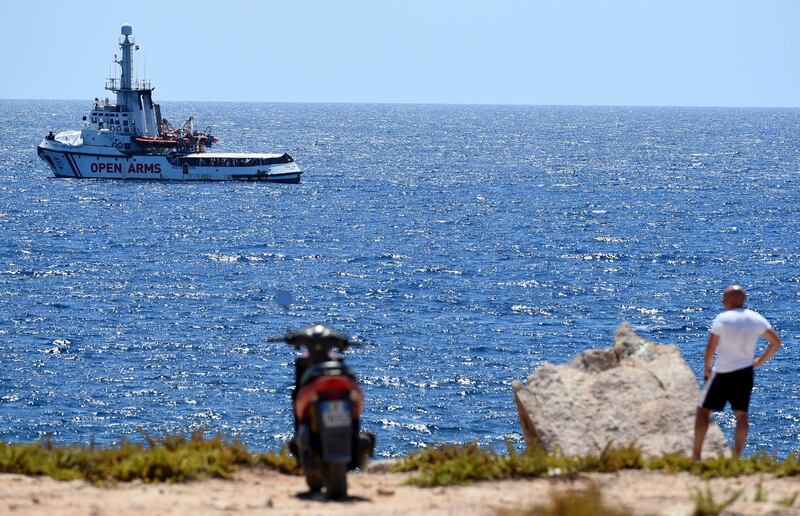 Spanish migrant rescue ship Open Arms is seen close to the Italian shore in Lampedusa, Italy on Monday. Photograph: Guglielmo Mangiapane/Reuters