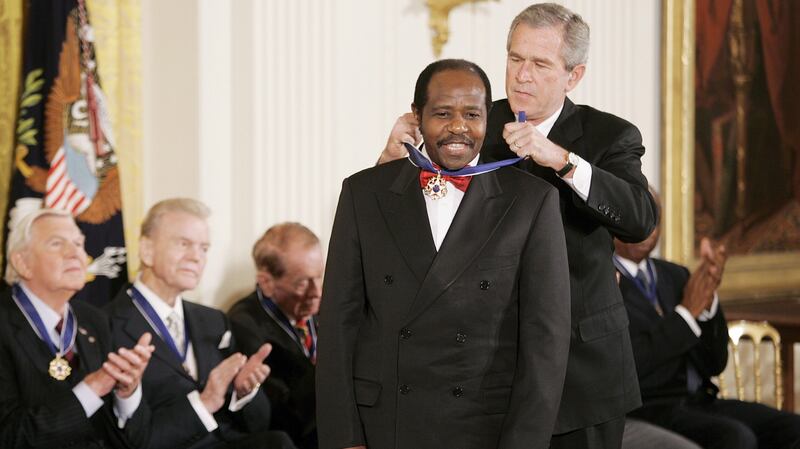 US president George W Bush awarding the US presidential medal of freedom to Paul Rusesabagina in 2005. Photograph:  Shawn Thew/EPA
