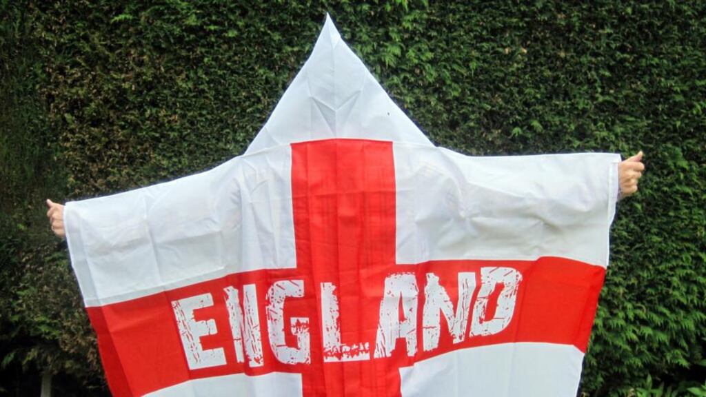 A man wears a “wearable England flag” made by Asda, as the supermarket defended the flag after claims it resembles a Ku Klux Klan outfit. Photograph: Carmel Wilkinson/PA Wire