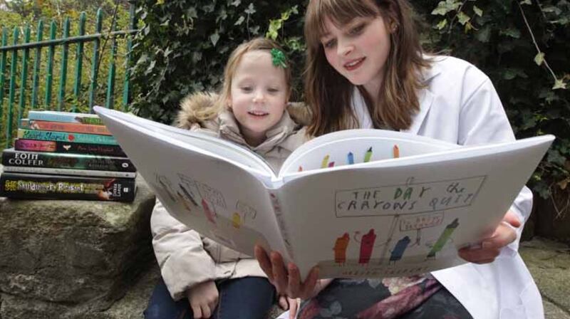 Nahla Burke consults Children’s Books Ireland Book Doctor Kim Harte. Photograph: Mark Stedman/Photocall Ireland