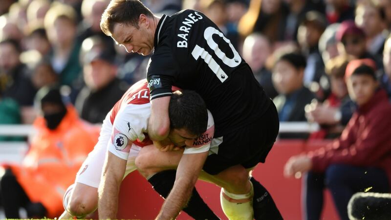 Sokratis Papastathopoulos and Ashley Barnes get to grips. Photo: Shaun Botterill/Getty Images