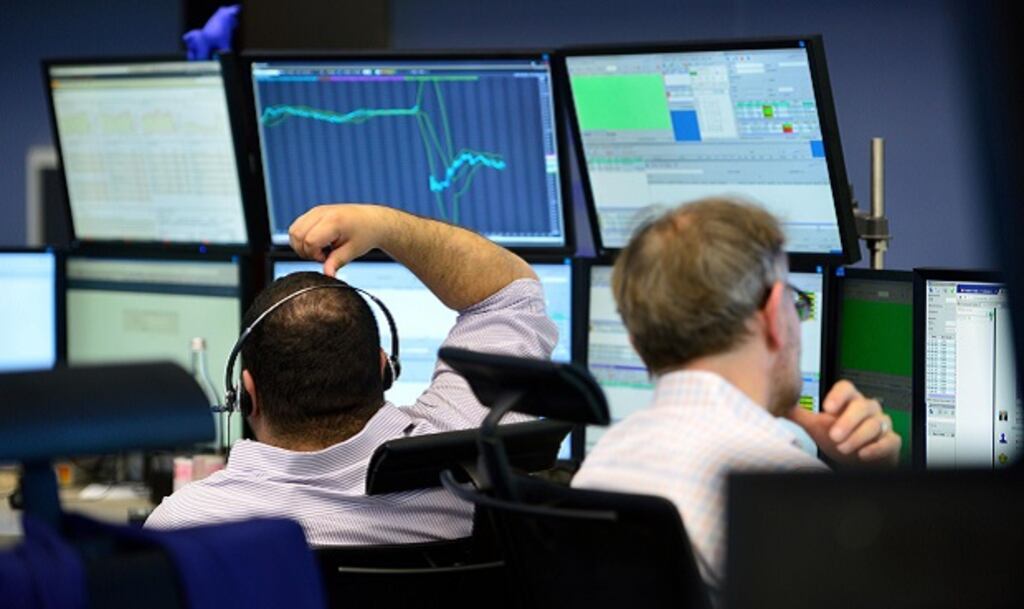 Traders sit at their desk at the Frankfurt Stock exchange the day after a majority of the British public voted for leaving the European Union. Photograph: Thomas Lohnes/Getty Images