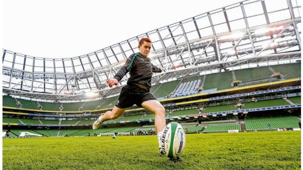 Ireland's Paddy Jackson gets in some place-kicking practice during the Captain's Run at the Aviva Stadium yesterday. photograph: billy stickland/inpho