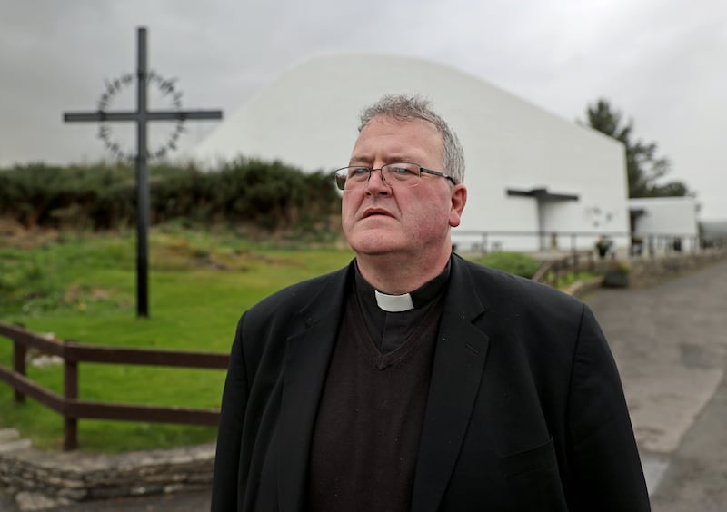 Parish priest Father John Joe Duffy outside St Michael's church in the village of Creeslough, Co Donegal. Photograph: Liam McBurney/PA