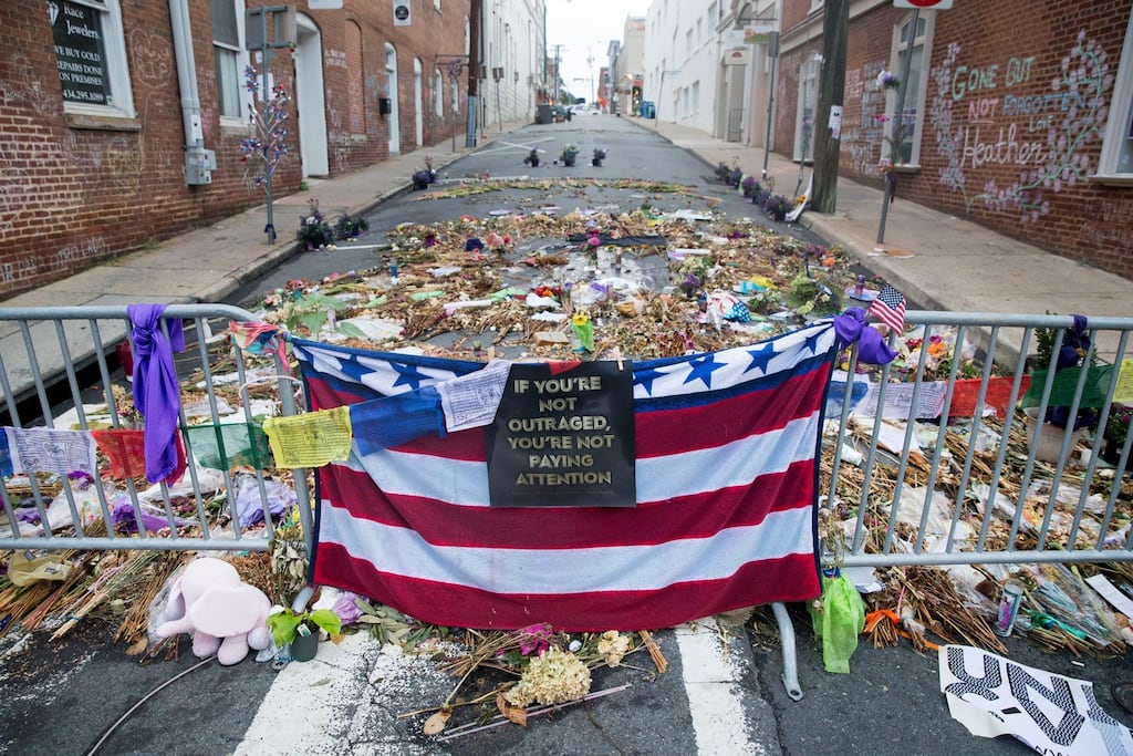 Flowers, candles and other items are placed in memory of Heather Heyer and for those affected by the violence at the site where a vehicle smashed into counter-protesters in Charlottesville, Virginia. Photograph: Michael Reynolds/EPA
