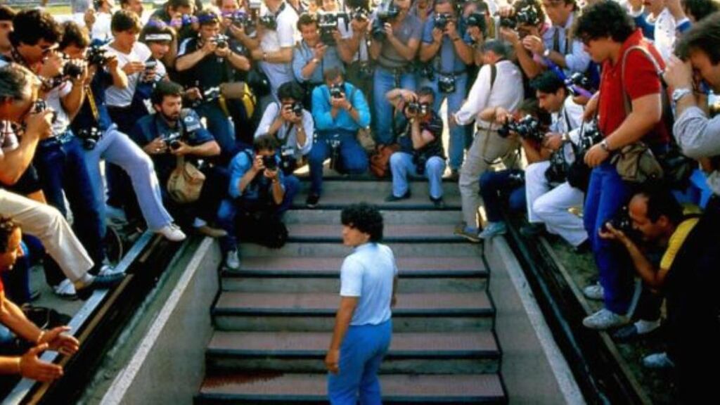Diego Maradona emerges into the San Paulo stadium for his media presentation after signing for Napoli. Photograph: Alfredo Copozzi