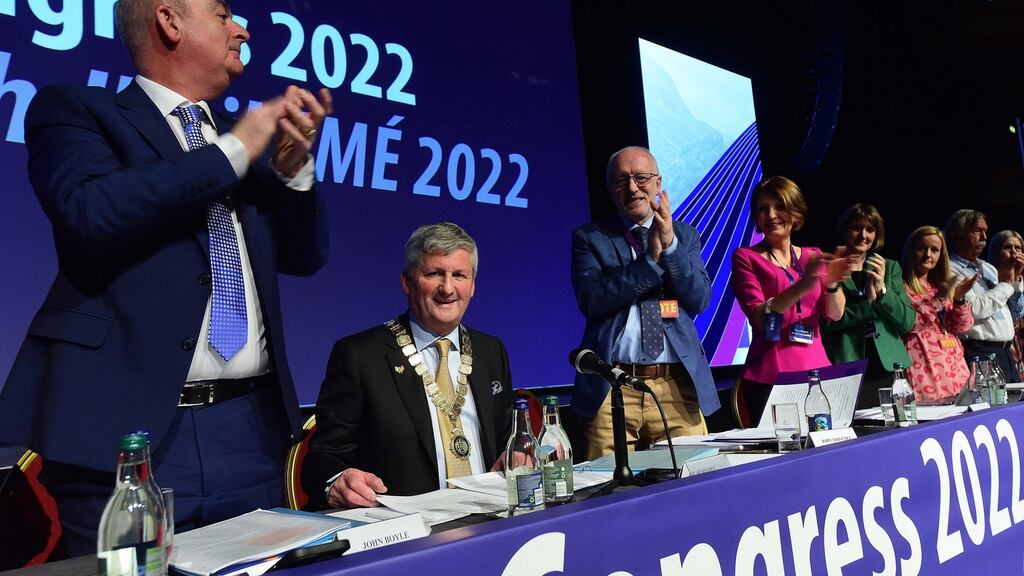 Joe McKeown (seated), president of the Irish National Teachers’ Organisation, is applauded by central executive members and delegates at the union’s annual congress in Killarney. Photograph: Moya Nolan