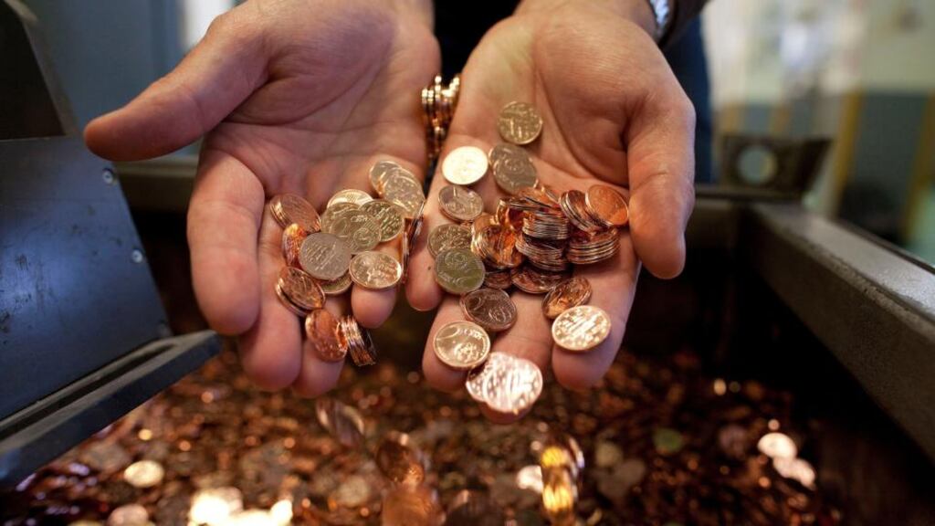 Newly-minted 2 cent euro coins. The Central Bank’s rounding trial in Wexford will seek to eliminate such coins as part of a trial. Photographer: Simon Dawson/Bloomberg