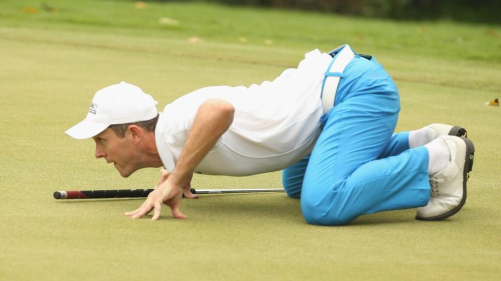 Stuart Manley of England lines up a put during round two of the 2014 Volvo China Open at Genzon Golf Club in Shenzhen. Photograph: Ian Walton/Getty Images