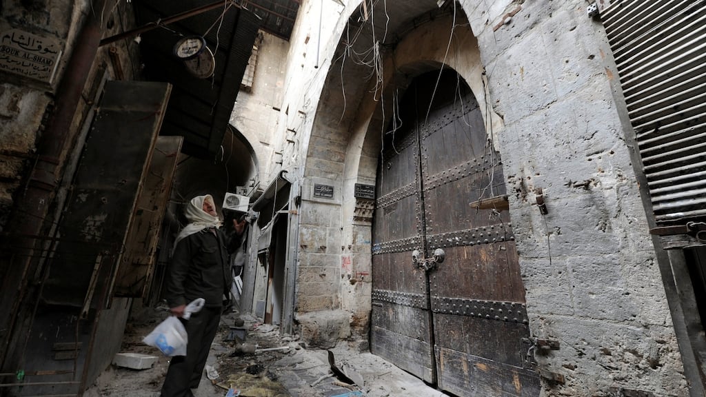 A man pictured  at the Khan al-Jumruk entrance to  the government controlled Old City of Aleppo, Syria  on Saturday. Photograph: Reuters