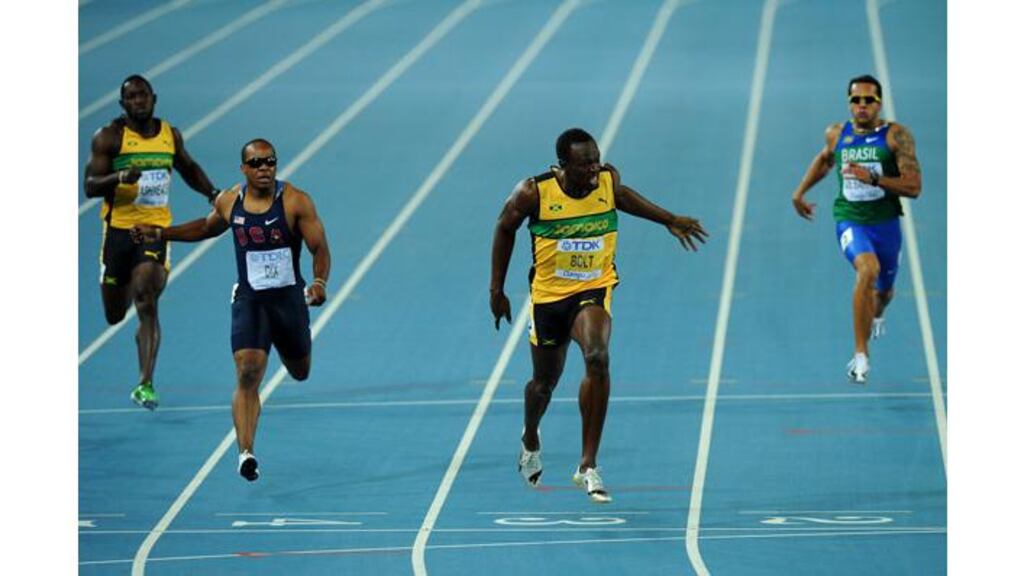 Usain Bolt of Jamaica sprints to victory in the men's 200 metres final ahead of Walter Dix of the USA at the World Athletics Championships in Daegu, South Korea. (Photograph: Stu Forster/Getty Images)