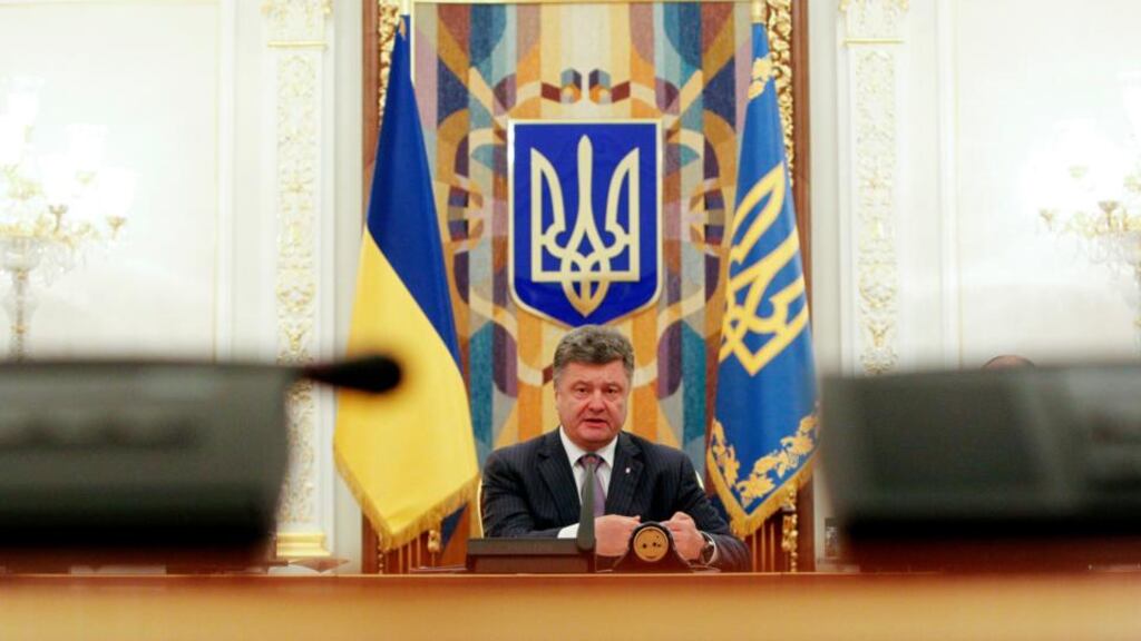 Ukrainian president Petro Poroshenko takes part in a meeting of the security council in Kiev yesterday. Poroshenko called yesterday for a truce in east Ukraine, where his government faces a rebellion by pro-Russian separatists, to provide time to seek agreement on a peace plan. Photograph: Reuters/Valentyn Ogirenko