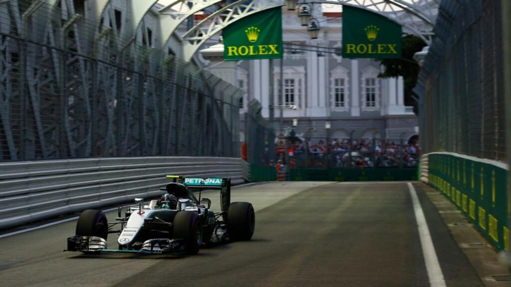Nico Rosberg left a beleaguered Lewis Hamilton trailing in his wake after he secured pole position for the Singapore Grand Prix in emphatic fashion. Photo: Wallace Woon/PA