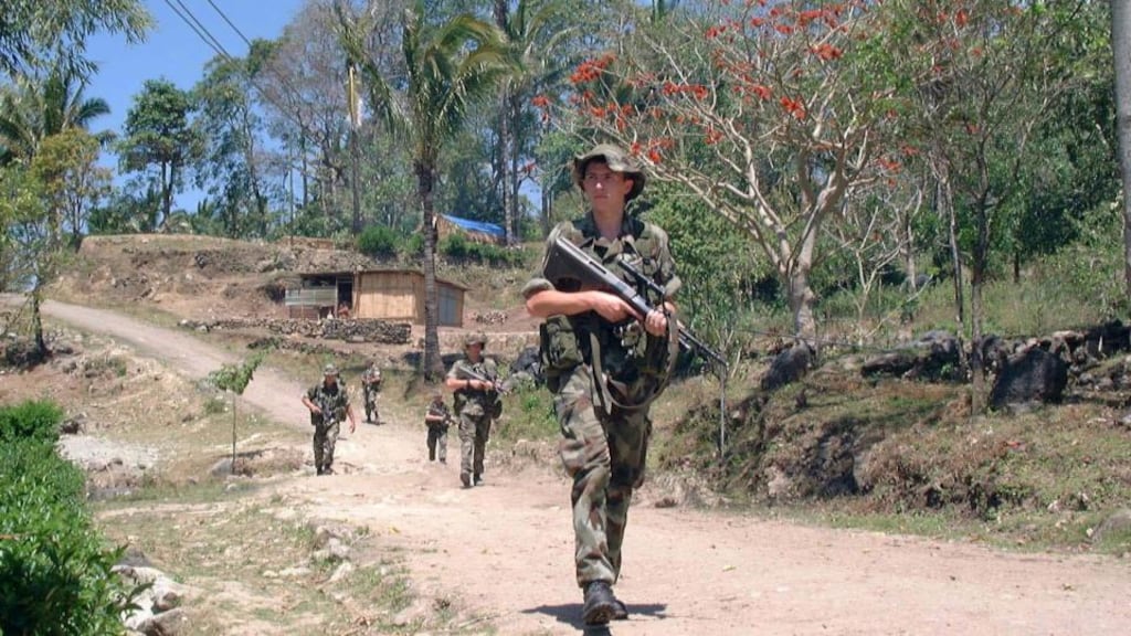 Ireland’s  participation in UN  peacekeeping missions, has allowed the Defence Forces access to the technical information necessary to achieve inter-operability with other   states  –  on patrol on UN mission in East Timor in   1999. Photograph: Conor O’Clery