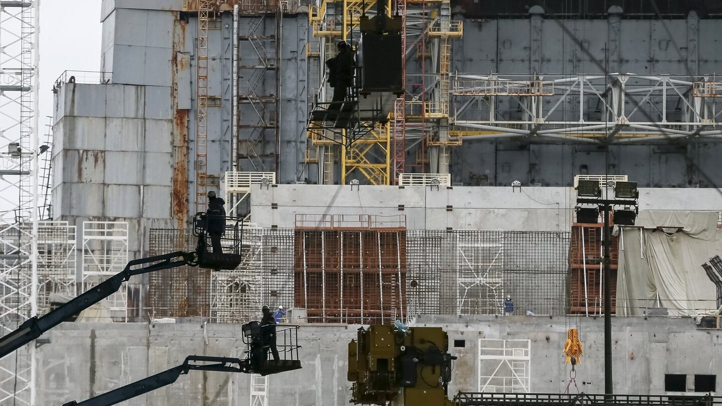 Employees work in front of the sarcophagus covering the damaged fourth reactor at the Chernobyl nuclear power plant in Ukraine in March 2016. Photograph: Gleb Garanich/Reuters