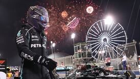 Lewis Hamilton holds off Max Verstappen to start season in style