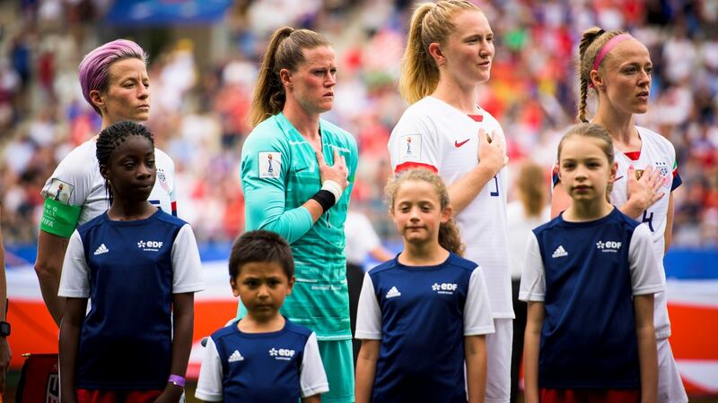 Rapinoe stands with her hands by her side during the national anthem. Photo: Pete Kiehart/The New York Times