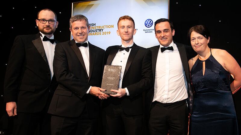Davitt Lamon, Awards Judge presents the Engineering Firm of the Year award to the Ethos Engineering team.
