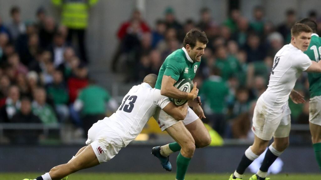 Jared Payne of Ireland is tackled by England’s Jonathan Joseph during the Six Nations game at the Aviva Stadium on Saturday. Ireland won 13-9. Photograph: Brian Lawless/PA.