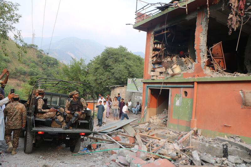 Members of the Pakistani army inspect the site of India's missile strike on Bilal Mosque in Muzaffarabad. Photograph: Amiiruddin Mughal/EPA