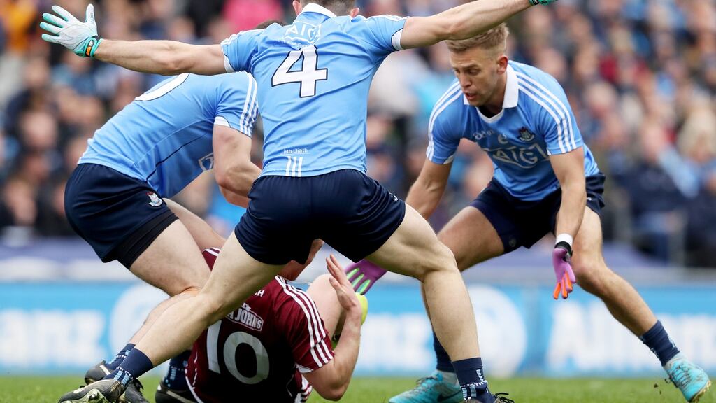 Dublin’s Brian Howard, David Byrne and Jonny Cooper with Eamonn Brannigan of Galway at the Allianz Football League Division 1 Final at Croke Park in April. Photograph: Bryan Keane/Inpho