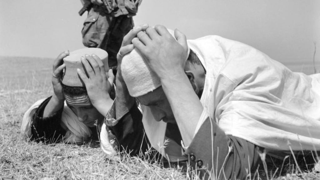 Algerians forced to the ground by the  French military in 1955 in Kabylia, Algeria: the Algerian war poisons relations between Paris and Algiers to this day.  Photograph: Michel Desjardins/Gamma-Rapho via Getty