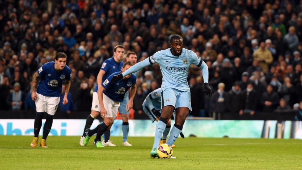 Manchester City’s Yaya Toure scores his side’s opening goal of the game from the penalty spot during the Barclays Premier League match at the Etihad Stadium. Photograph: Martin Rickett/PA