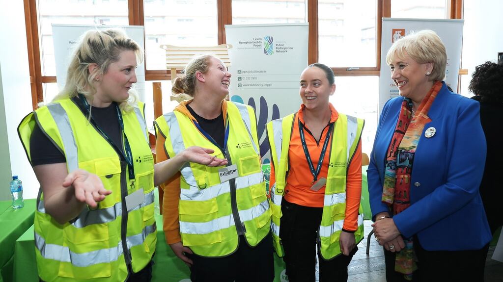 Carpentry  apprentices with Dublin City Council, Katherine Hannon, Jordan Kelly and Charlotte O’Reilly with Minister for Social Protection Heather Humphreys at Tallaght Stadium for the launch of construction work and skills week. Photograph: Maxwells