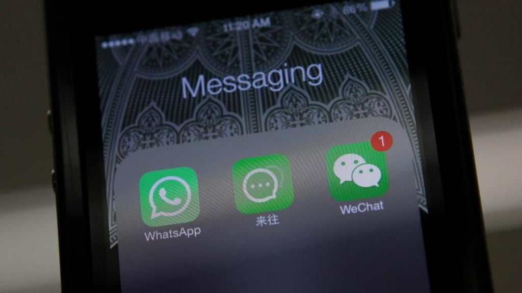 Icons of messaging applications WhatsApp of Facebook (L), Laiwang of Alibaba Group (C) and WeChat, or Weixin, of Tencent Group