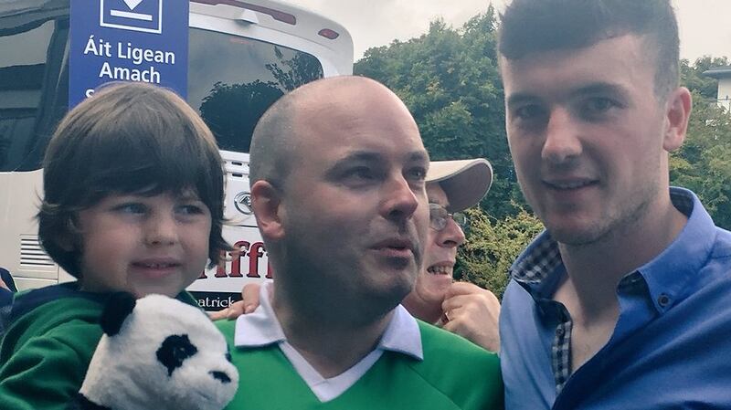 Rob Hanrahan and son Oisín with Limerick captain Declan Hannon after Sunday’s success