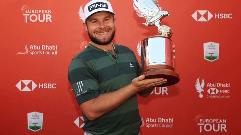 Tyrrell Hatton celebrates his win in Abu Dhabi. Photograph: Andrew Redington/Getty